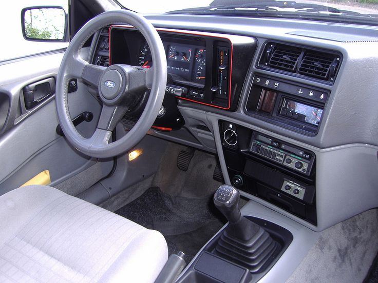 the interior of a car with dashboard and radio