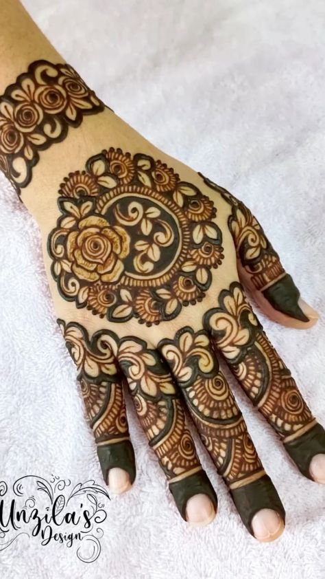 the hand is decorated with intricate designs