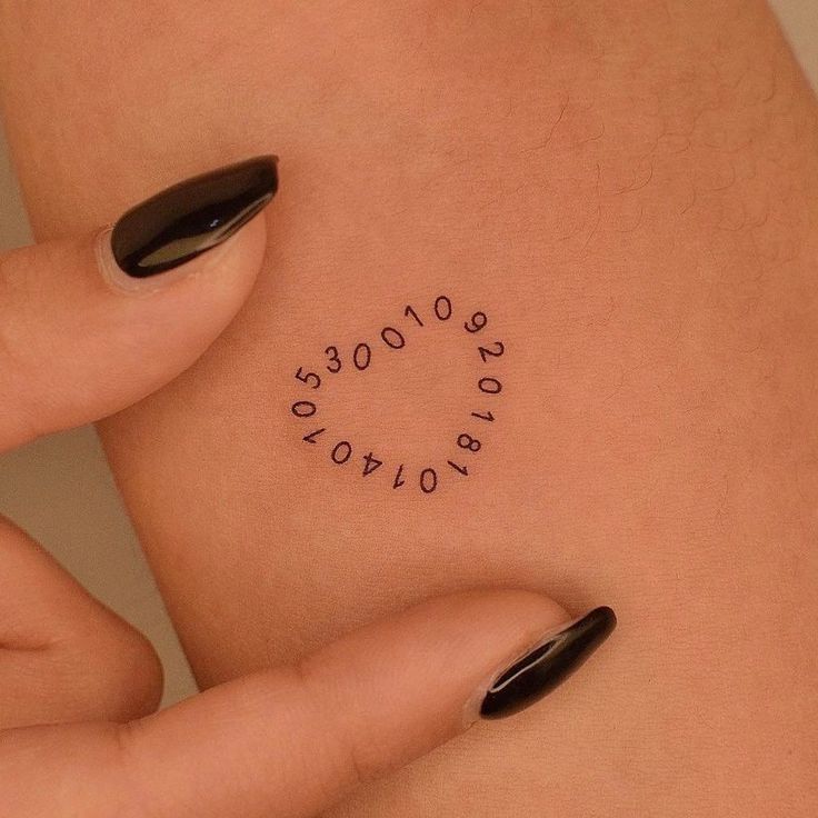 a woman's stomach with numbers written on it