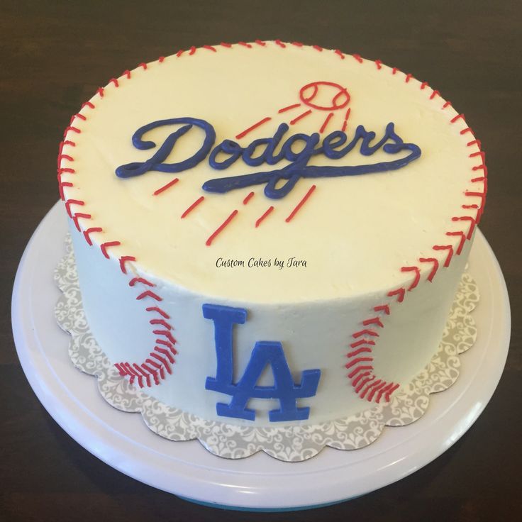 a dodgers baseball cake on a white plate