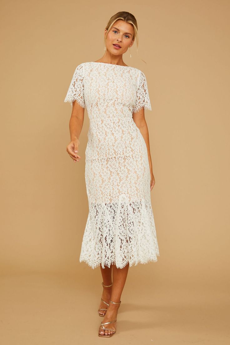 COSMOPOLITAN DRESS | Vow'd Weddings Elegant Spring Dresses With Lace Back, Feminine Sheath Lace Wedding Dress, Feminine Sheath Lace Dress For Wedding, Feminine Fitted Lace Dress With Lace Back, Lace Dress With Lace Back In Feminine Style, Elegant Delicate Lace Midi Dress For Wedding, Formal Scalloped Lace Midi Dress, Formal Midi Dress With Scalloped Lace, Elegant Lace Dress For Spring Gala