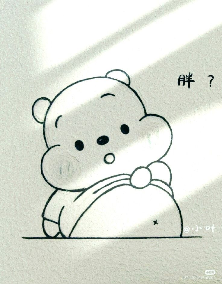 a drawing of a teddy bear sitting on top of a white wall with chinese characters above it