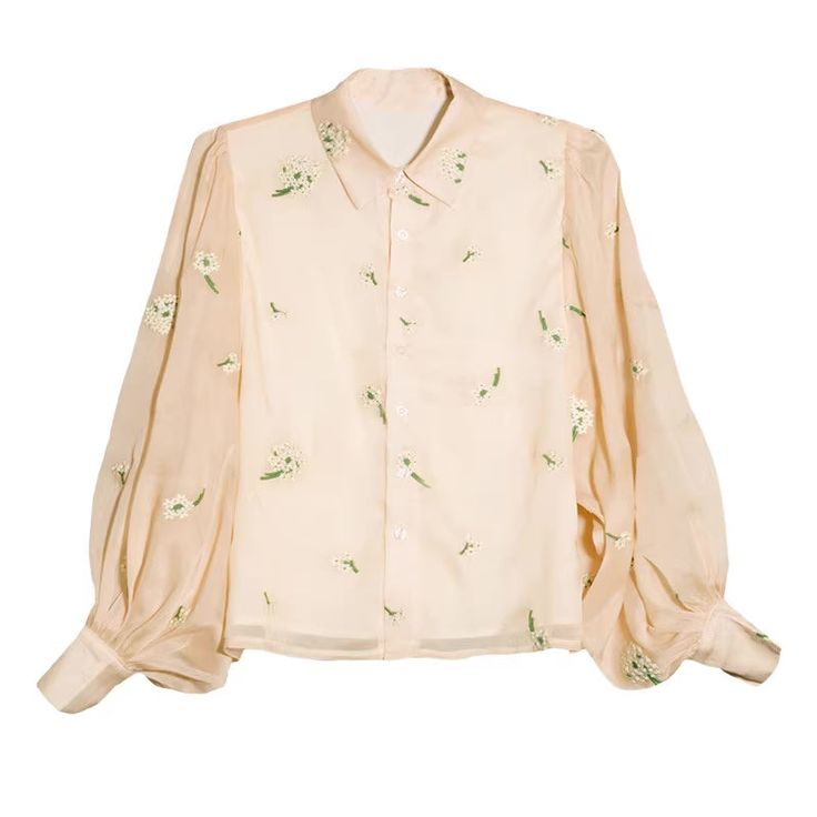 Sheer chiffon blouse with embroidered ditsy florals all over and super puffy sleeves. Match it with the Delicate Daisy Embroidered Pinafore or Classic Belted Buckle Midi Skirt. S: 14" across shoulders, 40" chest, 24" lengthM: 14.5" across shoulders, 41.5" chest, 24" lengthL: 15" across shoulders, 43" chest, 24.5" lengthXL: 15.5" across shoulders, 44.5" chest, 24.5" length Spring Bishop Sleeve Tops For Daywear, Summer Blouse With Sheer Sleeves For Daywear, Spring Bishop Sleeve Blouse With Floral Embroidery, Spring Workwear Tops With Lantern Sleeves, Spring Lantern Sleeve Tops For Work, Spring Floral Embroidered Blouse With Bishop Sleeves, Spring Floral Embroidery Blouse With Bishop Sleeves, Long Sleeve Embroidered Top With Floral Design For Summer, Elegant Long Sleeve Embroidered Top For Spring