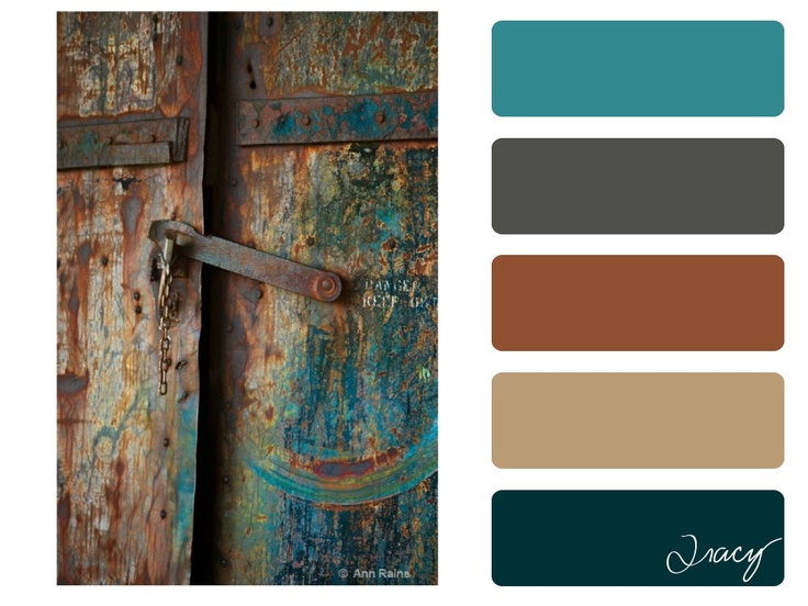 an old door with rusted paint and metal bars on the bottom, along with color swatches