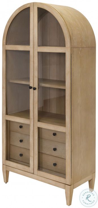 an arched wooden cabinet with drawers and shelves