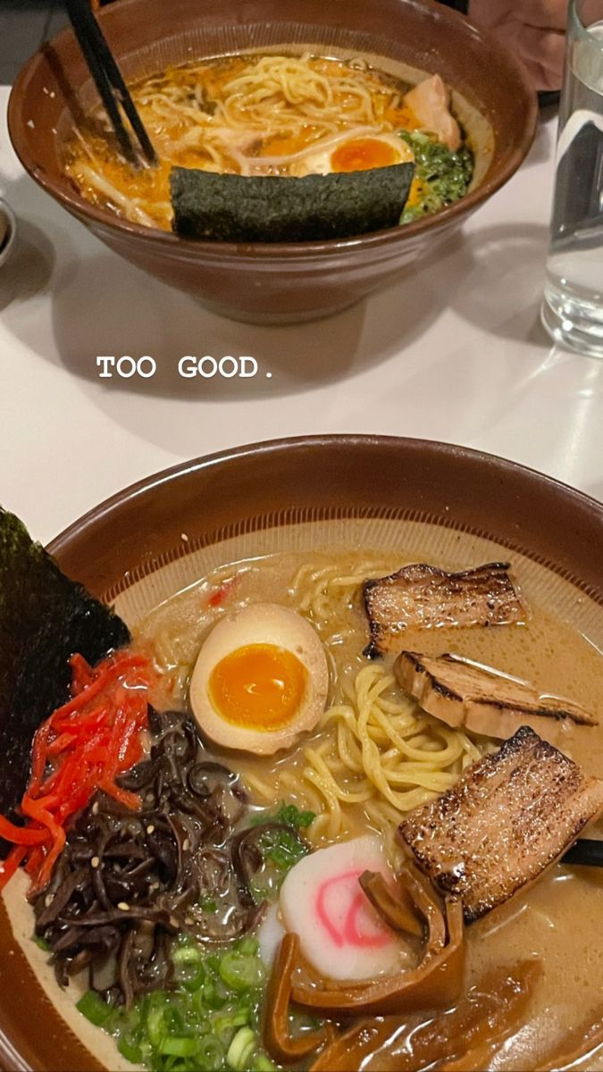 two bowls filled with different types of food next to each other on a table top