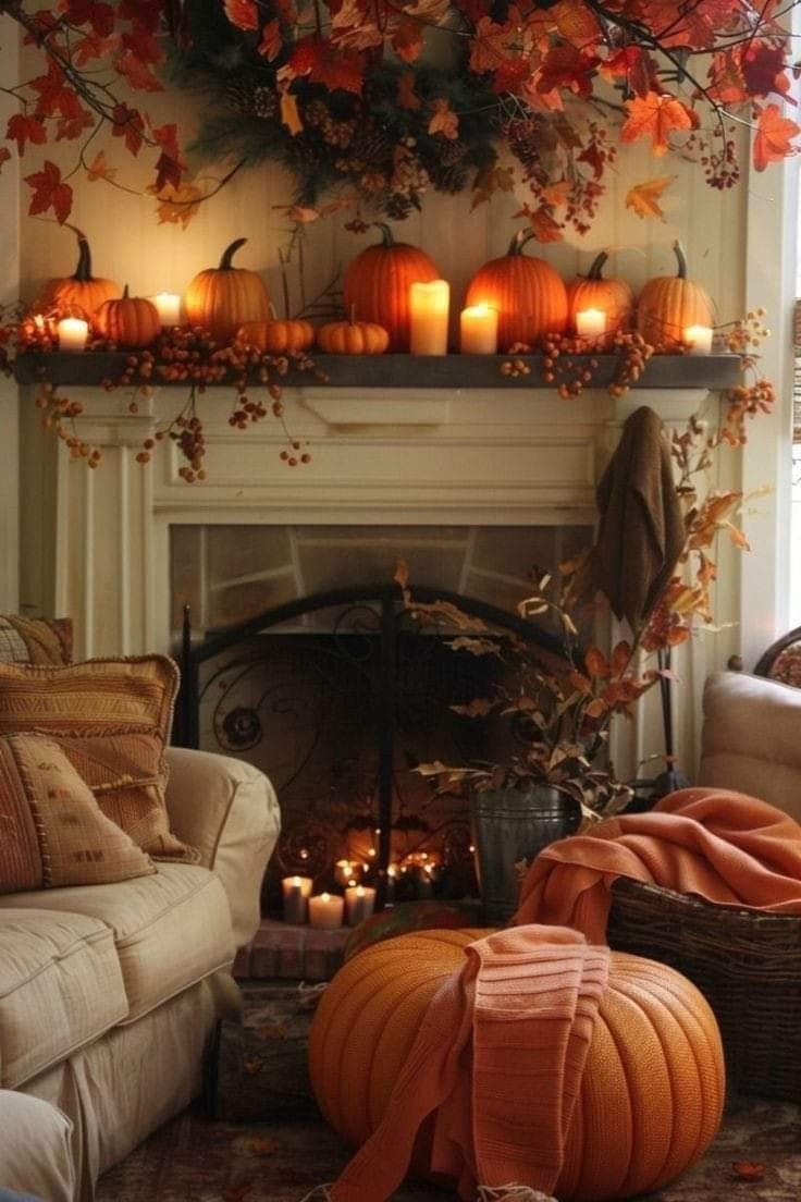 a living room filled with lots of pumpkins and candles on top of a fireplace