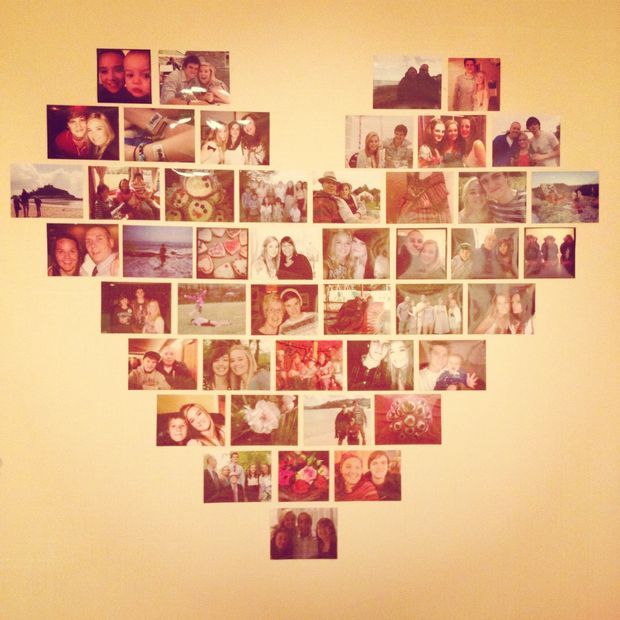 a heart shaped photo collage is displayed on a wall