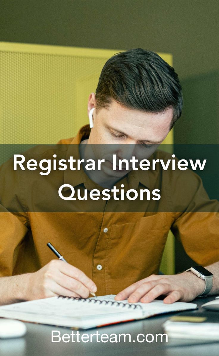 a man sitting at a desk writing on a piece of paper with the words register interview questions