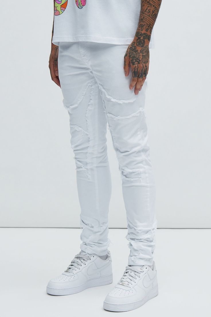 Available In White. Stacked Skinny Fit Stretch Denim Zip Fly Button Closure 5 Pocket Body Fray With Patch Detail Disclaimer: Patch Placement May Vary 98% Cotton 2% Spandex Imported | Mens Got Your Back Patched Stacked Skinny Jeans in White size 40 by Fashion Nova Ripped Fitted Cotton Jeans, Fitted Ripped Cotton Jeans, White Distressed Fitted Jeans, Fitted Distressed White Bottoms, White Washed Bottoms For Streetwear, Stretch Distressed White Bottoms, White Stretch Ripped Jeans, Slim Fit White Denim Bottoms, White Slim Fit Denim Bottoms