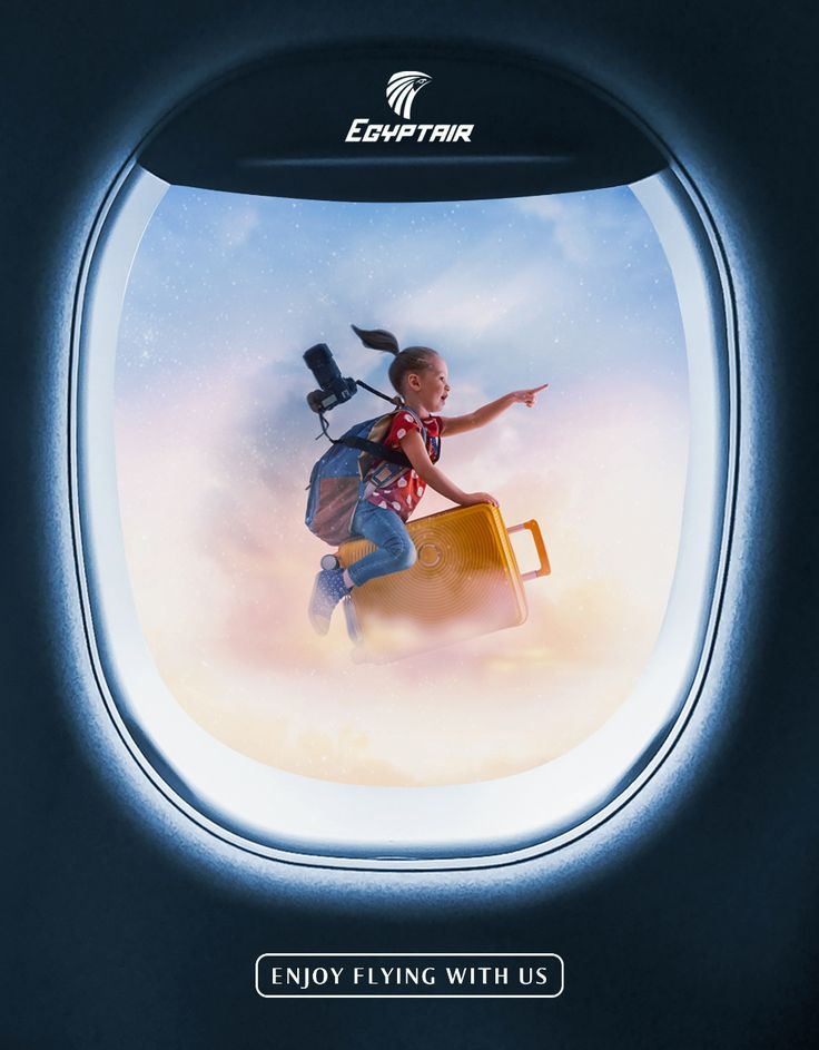 an airplane window with a little boy flying in the sky and holding a bird on his back