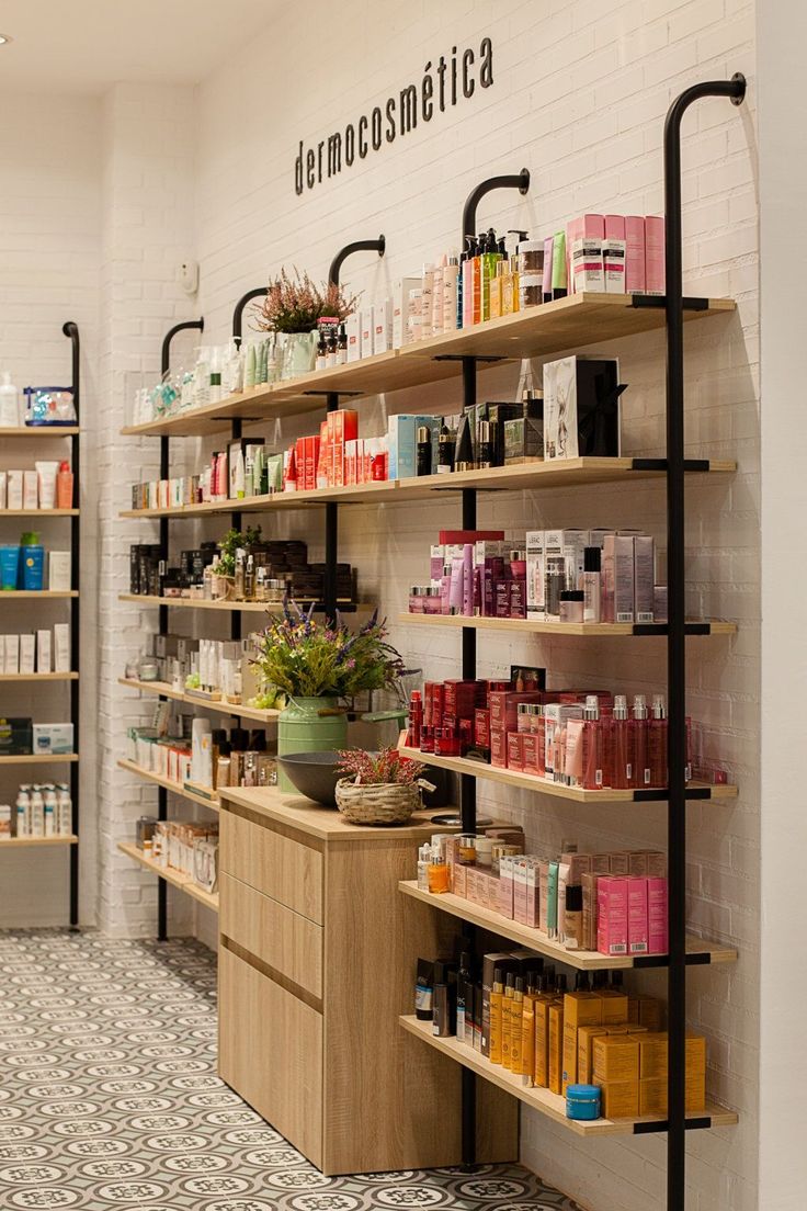 the inside of a store with shelves filled with cosmetics and personal care products on display