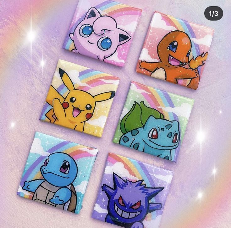 four different colored pokemon coasters on a purple background with rainbow and stars in the background