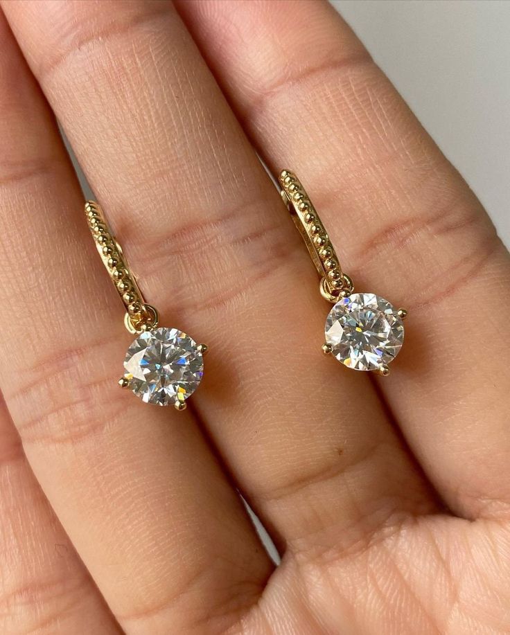 1.70CTW Moissanite Latch back Clip Earrings, 14k Gold Hoops, Dangle Hoop Wedding Earrings,Anniversary Gift,Huggie Hoop Earrings,Gift For Her ♣ Stone Details ☛ Stone Weight & Size: 1.70CTW (6.0 MM) Round Cut Moissanite ☛ Stone Color: (White) ☛ Clarity - VVS1 ☛ Luster: Excellent ☛ Hoops Width: 1.80 MM ☛ Hoops length: 10.50 MM ☛ Make: High Quality ☛ Center Shape: Round Cut Moissanite ☛ Metal Change(10k/14k/18k White/Yellow/Rose Gold) ☛ Handmade item ★ Moissanite Guarantee :   Test By Diamond Tester Its Test Show Positive 100% I accept custom-making orders. please contact me if you need this service. All the jewelry in my store is handmade .it may take 2-3 weeks to finish. ♣ Buy with Warranty: ☛ 14 Days Money Back Guarantee; ☛Excellent Customer Service; ☛  Free Shipping and insurance WORLDWIDE Small Hoop Wedding Jewelry With Vvs Clarity, Yellow Gold Huggie Earrings For Wedding With Round Cut, Fine Jewelry 14k Gold Hoop Earrings For Wedding, Cubic Zirconia Hoop Earrings With Prong Setting For Anniversary, 14k Gold Hoop Earrings For Wedding, Wedding Small Hoop Earrings With Vvs Clarity, Gold Diamond Cut Round Bridal Earrings, Wedding Huggie Diamond Earrings With Diamond Cut, Gold Round Cut Hoop Earrings Gift