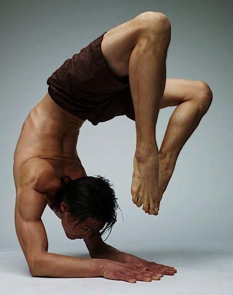 a man doing a handstand on his knees