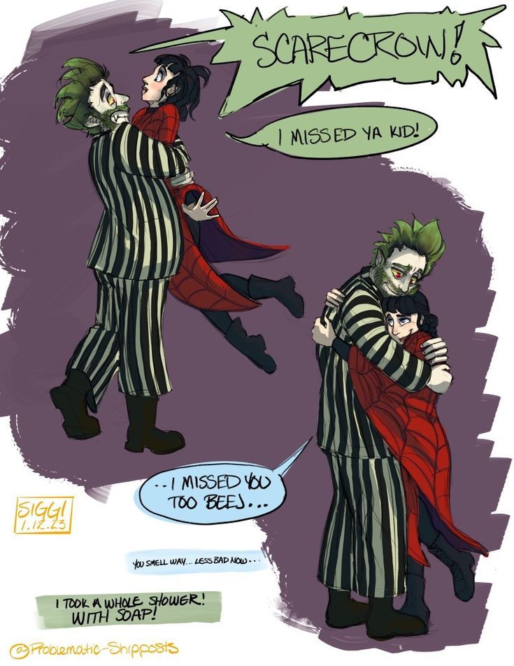 two people dressed as clowns and one is being hugged by another person in striped clothing