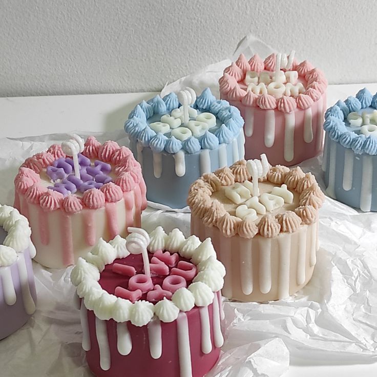 there are six cakes that have been decorated with icing on the top and bottom