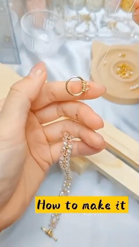 a woman is holding some jewelry in her hand and the words how to make it