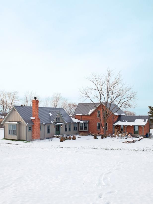 a house in the middle of a snow covered field