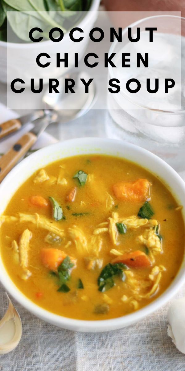 a bowl of coconut chicken curry soup on a table