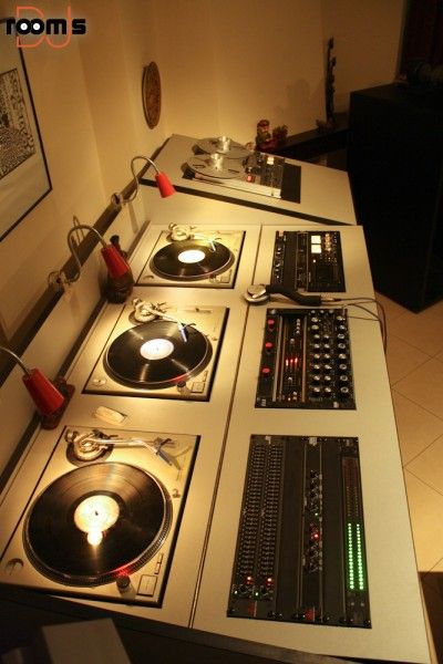 several turntables are lined up on the counter