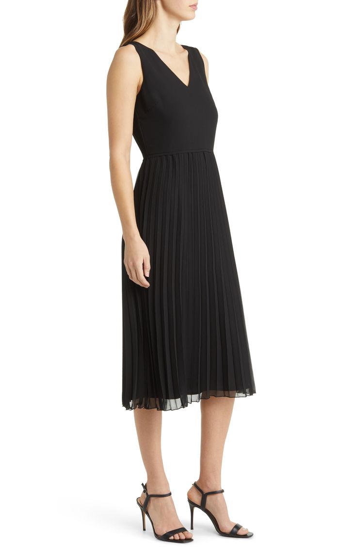 Designed in a sleeveless silhouette, this day-to-night dress is punctuated with a pleated chiffon skirt. 46" length (size 8) V-neck Sleeveless Lined 100% polyester Dry clean Imported Elegant A-line Sleeveless Dress With Pleated Hem, Classic Black Pleated Evening Dress, A-line Pleated Dress For Date Night, Classic Pleated Sleeveless Dress For Spring, Chic Chiffon Dress With Pleated Waist, Elegant Chiffon A-line Pleated Dress, Workwear Sleeveless Midi Dress With Pleated Bodice, Sleeveless Midi Dress With Pleated Back For Night Out, Formal Summer Sleeveless Dress With Pleated Bodice