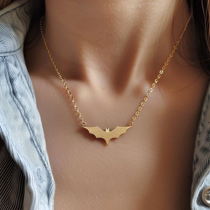 14k Gold Bat Charm Necklace, Gold Halloween Bat Necklace, Tiny Gold Bat Necklace, Spooky Bat Necklace, Dainty Halloween Bat Charm Necklace 🌺Item Details🌺 Item Name : Halloween Bat Necklace Metal : 925 Silver Necklace Size  : 16 Inch Pendant Size : 25*20MM                                                                  🌊 *About Us: Natural World Jewelry* 🐚 At Natural World Jewelry, we're passionate about bringing the serene beauty of the ocean to your everyday life. Our artisanal jewelry pie Spooky Halloween Jewelry For Costume Party, Vampire Style Halloween Necklace, Spooky Halloween Costume Party Jewelry, Gothic Gold Necklace With Clavicle Chain, Halloween Clavicle Chain Jewelry Gift, Handmade Vampire Necklaces For Halloween, Gothic Gold Jewelry For Halloween, Halloween Gift Clavicle Chain Jewelry, Halloween Party Pendant Jewelry