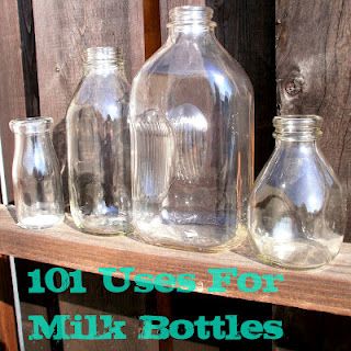 several glass bottles are lined up on a shelf with the words 101 uses for milk bottles