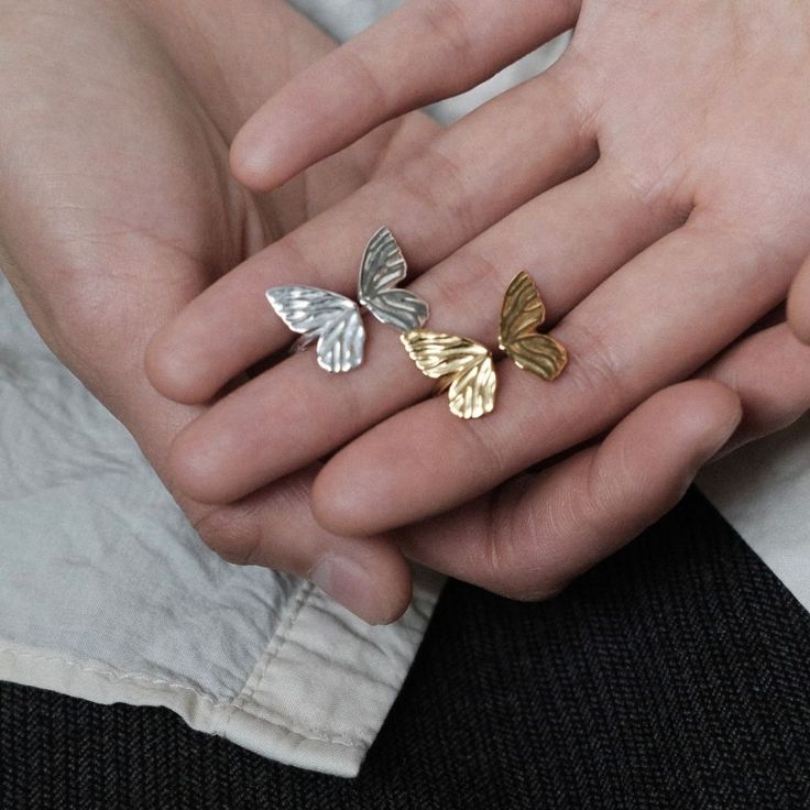 Why We Made This Adorn your fingers with the timeless beauty of our Adjustable Butterfly Ring, meticulously crafted in sterling silver and available in both silver and gold finishes. This exquisite piece of jewelry seamlessly combines elegance with versatility, making it a perfect accessory for any occasion. Designed to fit most finger sizes, providing comfort and flexibility. The ring features a stunning butterfly motif, delicately etched for a captivating and enchanting look. Product Details M Butterfly Motif, Butterfly Ring, Silver And Gold, Gold Finish, Timeless Beauty, Silver Rings, Sterling Silver, Ring, Silver