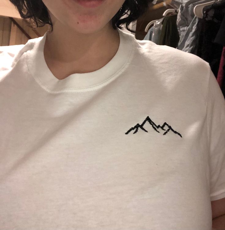 A unisex handmade 100% cotton t-shirt with a machine embroidered mountain design. A perfect top for anyone who loves the outdoors or adventures! Thank you for your support! Reach out with any questions or if you have a custom request. Mountain Design, Embroidery Tshirt, Mountain Tshirt, Mountain Designs, Embroidered Tshirt, T Shirt Ideas, Embroidery Ideas, Shirt Ideas, The Outdoors