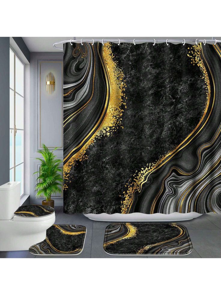 a bathroom with black and gold decor on the shower curtain, rugs and rugs