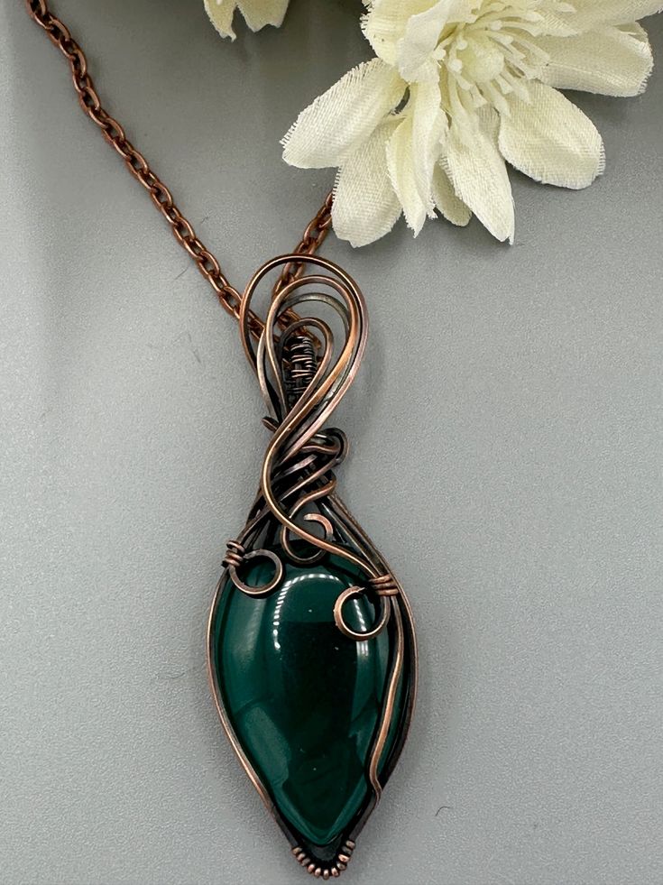 Green Onyx teardrop wrapped in oxidized copper wire to give it an antique look. Pendant is 3 inches tall and 1 inch tall. Comes with a free chain! Wire Wrapped Teardrop Copper Jewelry, Copper Teardrop Wire Wrapped Jewelry, Teardrop Copper Wire Wrapped Jewelry, Hand Wrapped Copper Teardrop Jewelry, Unique Copper Wire Teardrop Pendant Jewelry, Handmade Copper Wire Teardrop Pendant Jewelry, Bronze Teardrop Jewelry In Copper Wire, Artisan Teardrop Copper Necklace, Wire Wrapped Copper Wire Teardrop Pendant Necklace