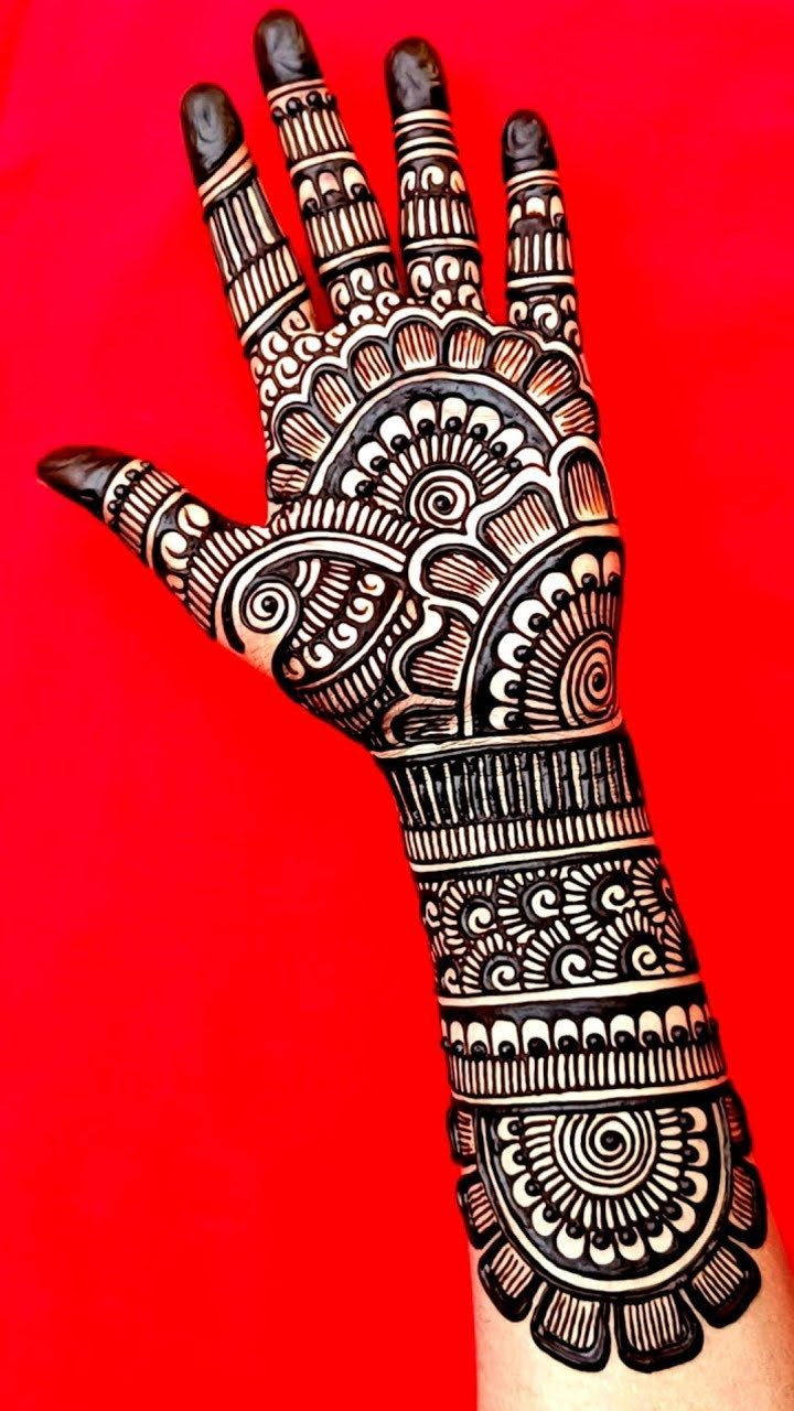 the hand is decorated with intricate designs