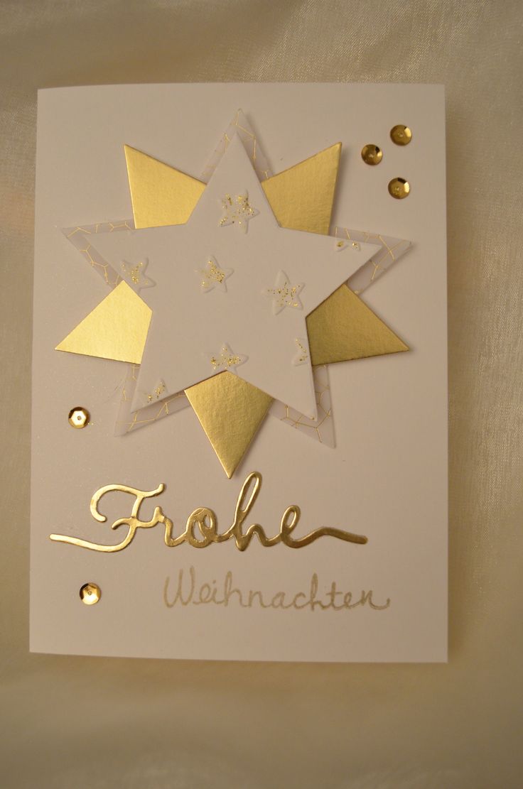 a white card with gold foil stars and the words frolle wannacecken