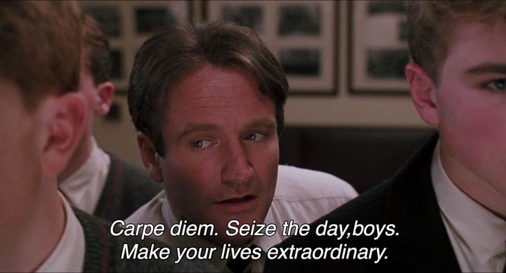 two men are talking to each other in front of a quote from the movie carpe diem seze the day boys