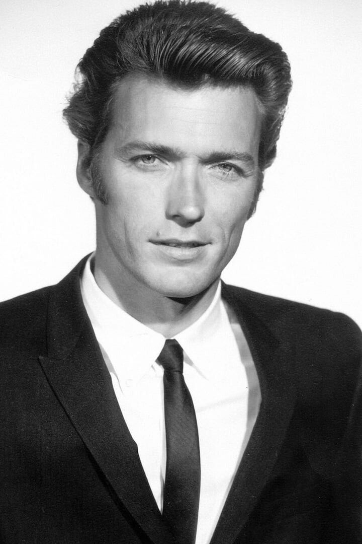 a black and white photo of a man in a suit