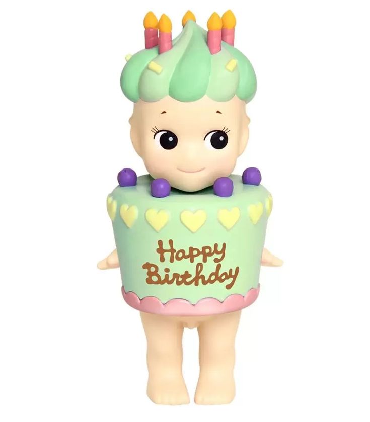 a toy figurine with a birthday cake on it