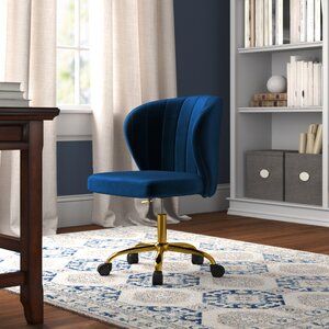 a blue office chair sitting on top of a wooden desk next to a book shelf