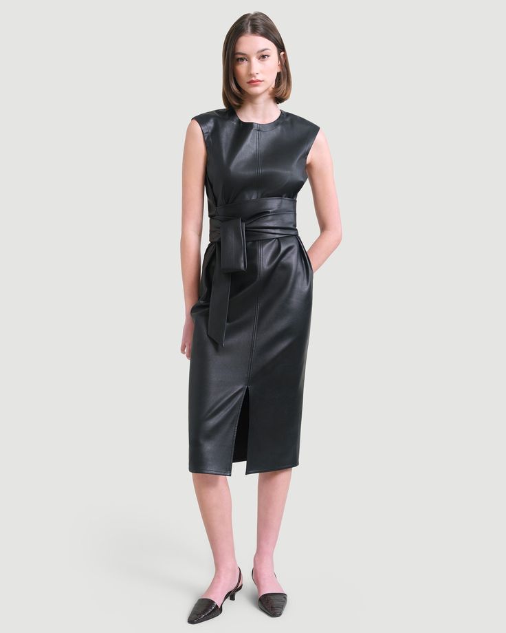 A sleek and modernized take on the LBD — this vegan leather dress is perfect for the office layered over a long-sleeve tee or on its own for date night. See below for our general Size Guide and available measurements Made of polyester, lining made of polyester Machine wash cold separately, tumble dry at low temperature, cool iron as needed Leather Midi Dress For Work, Leather Midi Dress For Night Out, Sleek Leather Dress For Work, Sleek Leather Dresses For Workwear, Sleek Leather Workwear Dress, Sleek Office Dresses For Fall, Sleek Leather Dress For Fall, Elegant Knee-length Leather Midi Dress, Black Leather Dresses For Office