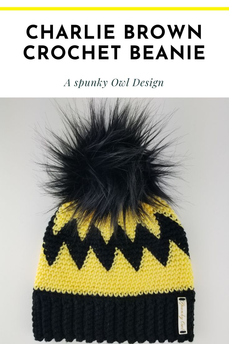 a yellow and black knitted beanie with the words charlie brown crochet beanie