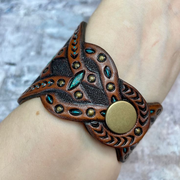 Artisan Adjustable Cuff Leather Bracelet, Adjustable Leather Cuff Bracelet, Vintage Adjustable Jewelry With Leather Strap, Adjustable Unique Leather Bracelet, Brown Leather Cuff Jewelry, Brown Southwestern Jewelry With Patina, Southwestern Brown Jewelry With Patina, Adjustable Hand Tooled Brown Leather Bracelet, Unique Adjustable Bracelet With Leather Strap