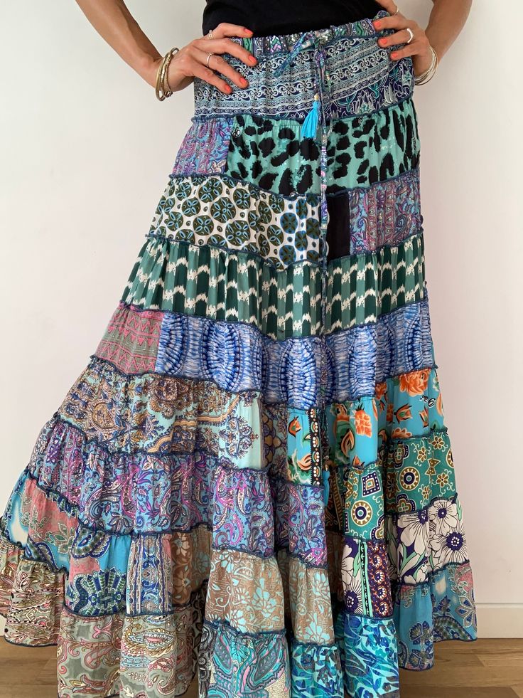 "This gorgeous colourful gypsie skirt is all fun to wear, boho style inspired long and flowy true hippy girl skirt it is free size and floor length always one of a kind  patchwork, made of varieties of different fabrics with floral patterns,  very easy to wear and comfy  it has elasticated waist band, and will fit most of sizes S-L MEASURE One Size Fits Most length 39 \"/100 cm waist 28-40\" / 66-100cm  For more boho style ideas please visit also  https://www.etsy.com/uk/shop/Gyaki CARE * Hand w Boho Print Tiered Skirt For Festival, Hippie Tiered Skirt With Boho Print, Summer Bohemian Tiered Maxi Skirt, Bohemian Tiered Maxi Skirt For Summer, Hippie Maxi Skirt With Boho Print, Multicolor Bohemian Maxi Skirt For Festivals, Bohemian Multicolor Maxi Skirt For Festivals, Multicolor Bohemian Dress With Ruffled Skirt, Bohemian Ruffled Maxi Skirt For Beach