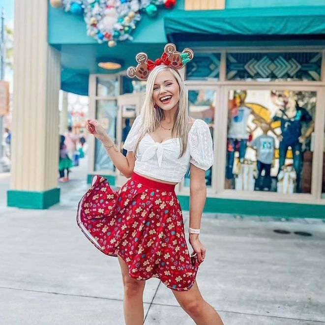 Time for something sweet this holiday season! We love gingerbread and Gingerbread Mickey and Minnie make the top of our list. Add a bit of holiday sweetness to your wardrobe this season with our Gingerbread Minnie and Mickey skater skirt. With a burgundy background, this skirt features Mickey and Minnie Gingerbread, candy canes, presents, trees, and more. The soft fabric and flared cut of this skater skirt are just a few of the reasons why it's bound to become a favorite in your wardrobe. The fl Mickey And Minnie Gingerbread, Disney World Christmas Outfit, Minnie Gingerbread, Mickey Gingerbread, Disney Christmas Outfits, Disney Christmas Party, Mickey And Minnie Christmas, Disney Trip Outfits, Disney Outfits Women