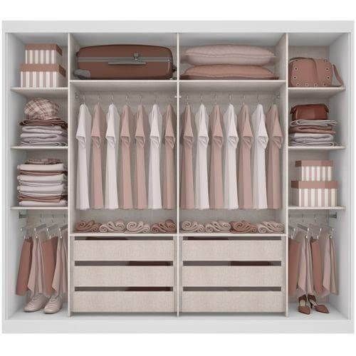 an organized closet with clothes, shoes and other items in it's storage area