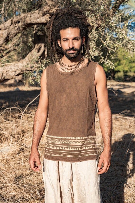 ❂ Walnut dyed brown hemp cotton tank top with tribal print . soft and earthy ❂⫸⫸ SIZE ⫸⫸S, M, L and XLPlease check the sizing chart in the last picture⫸⫸ MATERIALS ⫸⫸We focus on natural materials and aim to support traditional crafts and ancient skills ~striving to go deeper to the source of all materialsOur vision is to be able to connect with each being involved in the making from the very source,Being able to Source the most ethical, fair trade, Eco and conscious materials ⫸⫸ COLOR ⫸⫸❀ Please Bohemian Sleeveless Tank Top For Festival, Bohemian Sleeveless Festival Tank Top, Casual Cotton Tank Top For Festivals, Festival Cotton Tank Vest, Casual Brown Tank Top For Festival, Casual Brown Tank Vest, Bohemian Tank Vest For Summer, Casual Sleeveless Boho Print Tops, Brown Cotton Tank Top For Summer