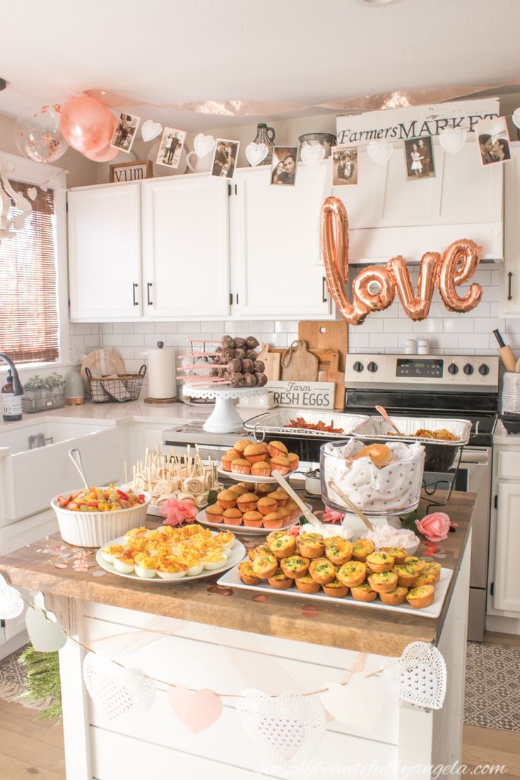 a kitchen filled with lots of food and balloons