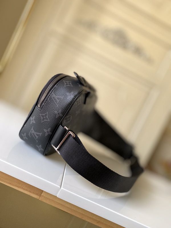 a black purse sitting on top of a white counter