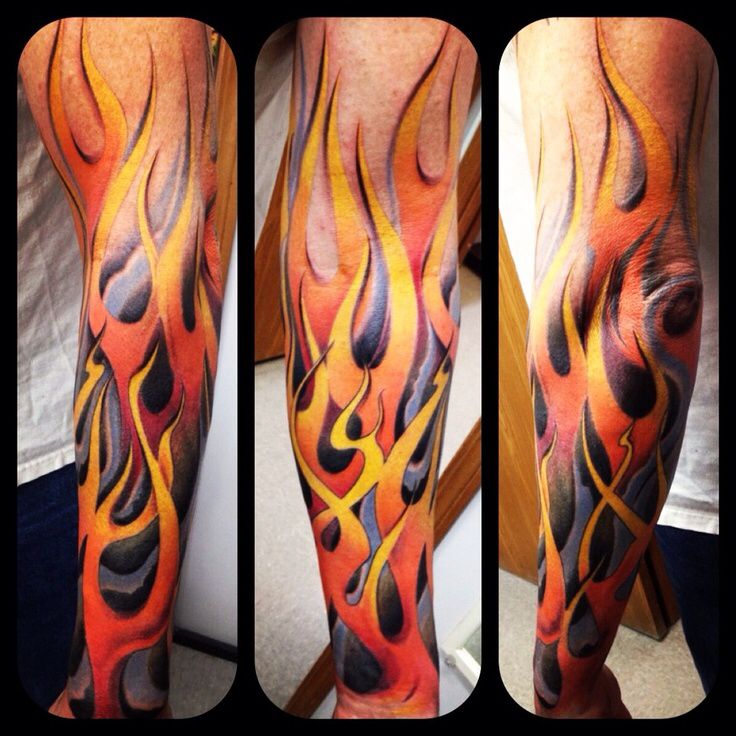 a man's leg with fire and flames tattoo on his arm, both in different colors