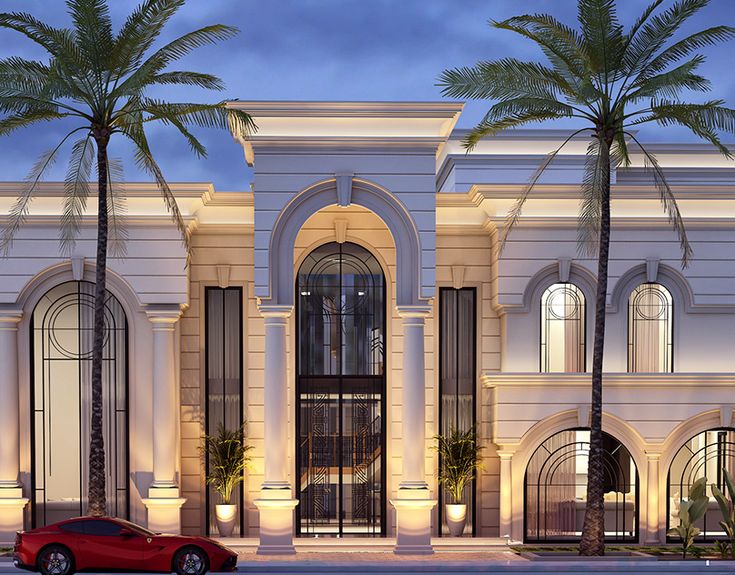 a red car is parked in front of a large white building with palm trees on the street