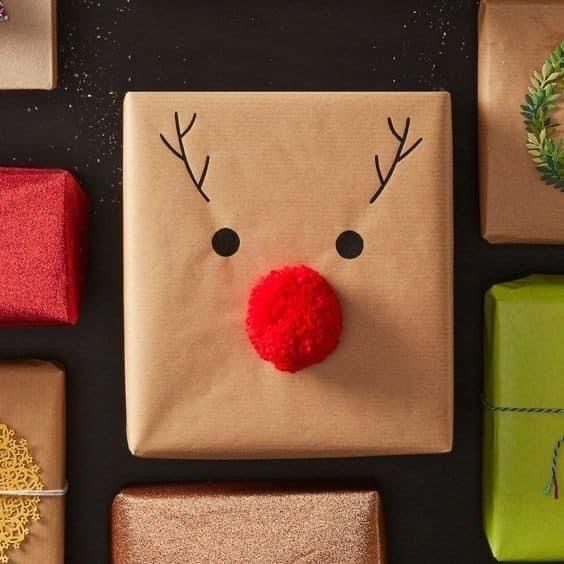 presents are wrapped in brown paper with reindeer's nose and nose painted on them